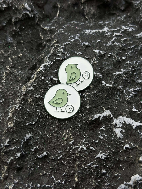Little Birdie magnetic ball markers on dark stone